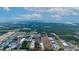 Aerial view of a large land plot near industrial buildings at 2103 W Kelly Park Rd, Apopka, FL 32712