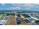 Aerial view of property with surrounding land and greenhouses at 2103 W Kelly Park Rd, Apopka, FL 32712