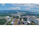 Aerial view of a large land plot near industrial buildings at 2103 W Kelly Park Rd, Apopka, FL 32712