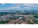 Aerial view of a large land plot near industrial buildings at 2103 W Kelly Park Rd, Apopka, FL 32712
