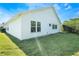 White house exterior with landscaping and lawn at 24801 Cranes Roost Cir, Leesburg, FL 34748