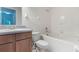 Bathroom with shower/tub combo and wood cabinets at 24801 Cranes Roost Cir, Leesburg, FL 34748
