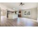 Open kitchen with island and stainless steel appliances at 24801 Cranes Roost Cir, Leesburg, FL 34748