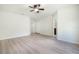 Spacious bedroom with ceiling fan and vinyl plank flooring at 24801 Cranes Roost Cir, Leesburg, FL 34748