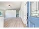 Bright and airy entryway with light wood flooring and a view into the living area at 24801 Cranes Roost Cir, Leesburg, FL 34748