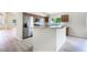 Modern kitchen with stainless steel appliances and breakfast bar at 24801 Cranes Roost Cir, Leesburg, FL 34748