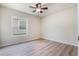 Bright bedroom with vinyl plank flooring and a window at 24801 Cranes Roost Cir, Leesburg, FL 34748