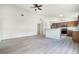 Open concept kitchen with a breakfast bar and stainless steel appliances at 24801 Cranes Roost Cir, Leesburg, FL 34748