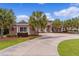 House exterior with circular driveway and palm trees at 10710 Sw 49Th Ave, Ocala, FL 34476