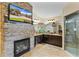Spa-like bathroom featuring a fireplace and a large walk-in shower at 10710 Sw 49Th Ave, Ocala, FL 34476