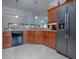 Modern kitchen with ample cabinetry, granite counters, and stainless steel appliances at 1751 Ashwood Run, The Villages, FL 32162