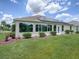 Single-story home with solar panels at 1751 Ashwood Run, The Villages, FL 32162