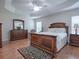 Spacious main bedroom with wood floors and two nightstands at 1751 Ashwood Run, The Villages, FL 32162