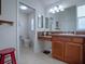 Bathroom with a toilet, vanity, and a separate shower at 1751 Ashwood Run, The Villages, FL 32162