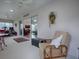 Relaxing sunroom with comfortable seating at 1751 Ashwood Run, The Villages, FL 32162