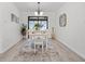 Charming dining room features a white table with seating for six at 1226 Palmetto Rd, Eustis, FL 32726