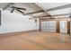 Clean garage with overhead door and painted floor at 1609 Magnolia Ave, The Villages, FL 32159