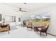 Sunroom with a view of the golf course and comfortable seating at 1609 Magnolia Ave, The Villages, FL 32159