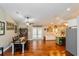 Farmhouse-style dining room with wooden table and access to the kitchen at 4399 Indigo Rd, Groveland, FL 34736