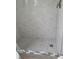 Tile shower with pebble floor and glass door at 1100 E Caroline St # 115, Tavares, FL 32778