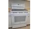 White electric range and built-in dishwasher at 1100 E Caroline St # 115, Tavares, FL 32778