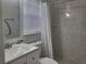 Updated bathroom with tile shower and vanity at 1100 E Caroline St # 115, Tavares, FL 32778