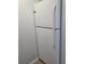 White refrigerator in corner of kitchen at 1100 E Caroline St # 115, Tavares, FL 32778