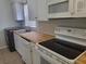 Updated kitchen with butcher block countertops and stainless steel appliances at 1100 E Caroline St # 115, Tavares, FL 32778