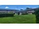 Neatly landscaped yard with lush greenery and well-maintained lawn at 1100 E Caroline St # 115, Tavares, FL 32778