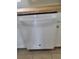 Modern white built-in dishwasher in kitchen at 1100 E Caroline St # 115, Tavares, FL 32778