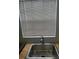 Modern stainless steel kitchen sink with updated faucet at 1100 E Caroline St # 115, Tavares, FL 32778