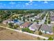 Aerial view of houses in a residential neighborhood at 9342 Oglethorpe Dr, Groveland, FL 34736