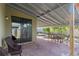 Covered patio with brick flooring and outdoor seating at 9342 Oglethorpe Dr, Groveland, FL 34736
