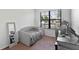 Cozy bedroom with daybed, workspace, and large window at 9342 Oglethorpe Dr, Groveland, FL 34736
