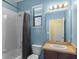 Bathroom with tub, shower, and single vanity at 9342 Oglethorpe Dr, Groveland, FL 34736