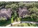 Aerial view of homes with tile roofs at 33 Camino Real # 303, Howey In The Hills, FL 34737