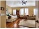 Spacious bedroom with hardwood floors and sitting area at 33 Camino Real # 303, Howey In The Hills, FL 34737