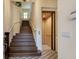 Elegant entryway with a grand staircase and private elevator at 33 Camino Real # 303, Howey In The Hills, FL 34737