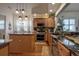 Modern kitchen with stainless steel appliances and granite countertops at 33 Camino Real # 303, Howey In The Hills, FL 34737