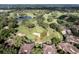 Aerial view of homes and golf course at 33 Camino Real # 303, Howey In The Hills, FL 34737
