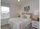 Cozy bedroom with a queen bed, soft color palette, and wall decor at 16388 Hamlin View St, Winter Garden, FL 34787