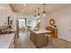 Bright kitchen with island, stainless steel appliances, and white shaker cabinets at 16388 Hamlin View St, Winter Garden, FL 34787