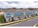 Townhomes with gray roofs and blue siding at 16388 Hamlin View St, Winter Garden, FL 34787