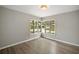Spacious bedroom with hardwood floors and large windows at 1261 W Lakeshore Dr, Clermont, FL 34711