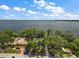 Aerial view showing home's waterfront location and lot size at 1261 W Lakeshore Dr, Clermont, FL 34711
