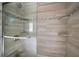 Large walk-in shower with built-in shelves and glass enclosure at 1261 W Lakeshore Dr, Clermont, FL 34711