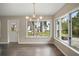 Bright dining room with water views and hardwood floors at 1261 W Lakeshore Dr, Clermont, FL 34711