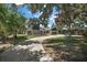 Two-story home with circular driveway and lush landscaping at 1261 W Lakeshore Dr, Clermont, FL 34711