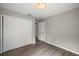 Bright bedroom with hardwood floors and large windows at 1261 W Lakeshore Dr, Clermont, FL 34711