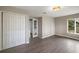 Bright bonus room features hardwood floors, double doors, and ample closet space at 1261 W Lakeshore Dr, Clermont, FL 34711